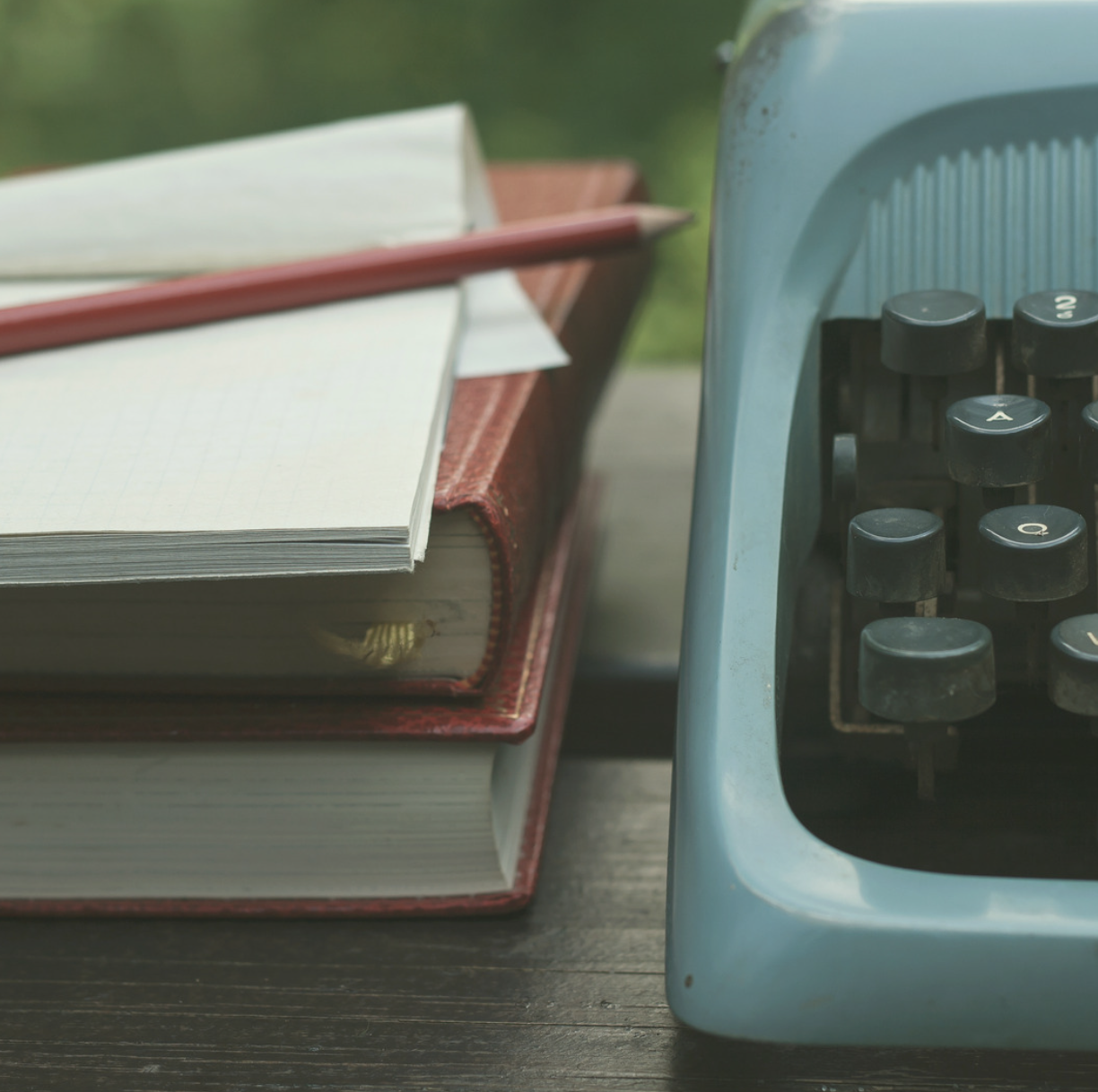 typewriter and books